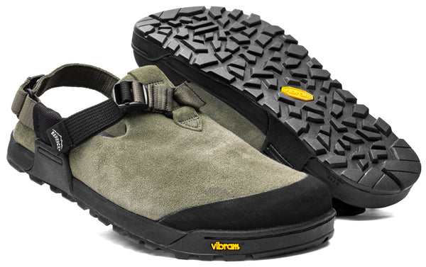The Bedrock Mountain Clog is a green suede outdoor sandal with black adjustable straps and rugged Vibram soles, displayed in both side and bottom views.