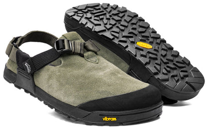 The Bedrock Mountain Clog is a green suede outdoor sandal with black adjustable straps and rugged Vibram soles, displayed in both side and bottom views.