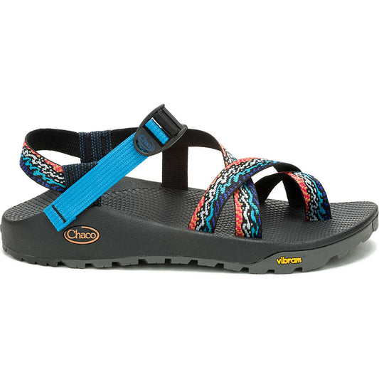 The Chaco Z2 Rapid Pro - Men's is a black adventure sandal with colorful patterned straps, blue accent strap, adjustable buckle, and a textured Vibram outsole for top water performance.