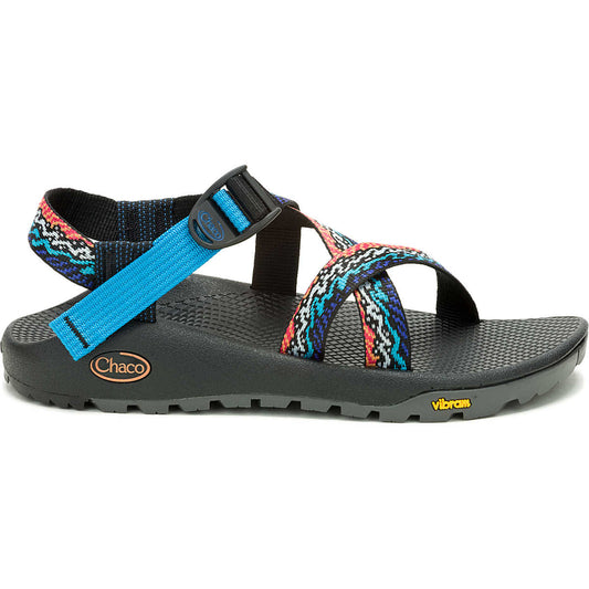 The Z1 Rapid Pro - Women's Chaco sandal features colorful patterned straps, adjustable blue webbing, and a textured Vibram outsole with Chaco and Vibram logos—ideal for water activities and active adventures.