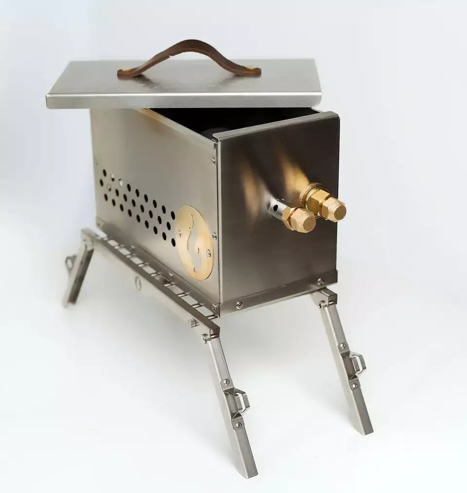 A LavaBox VolCanNo Trident Combo camp stove, made of stainless steel and equipped with a lid.