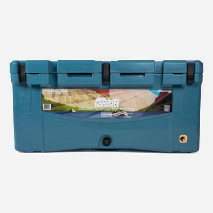 The Prospector 103 Raft Cooler by Canyon Coolers, bear-resistant with secure latches, features a striking graphic of a canyon on the front panel.