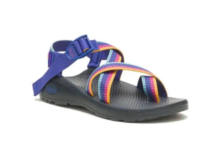 The Chaco ZCLOUD 2 – WOMEN'S sandal features a black sole with adjustable blue and rainbow-striped straps, offering comfort for hiking, outdoor adventures, or casual wear.