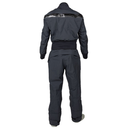 A woman wearing a dark blue Kokatat Icon (Hydrus 3.0) Drysuit and light-colored shoes stands with her back to the camera against a white background.