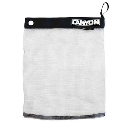 The "Stainless Mesh Drag Bag" by Canyon Coolers is a white mesh gear bag with a black band, secure Velcro seal, and metal eyelet. Ideal for outdoor adventures, "Canyon" is boldly printed on the band.