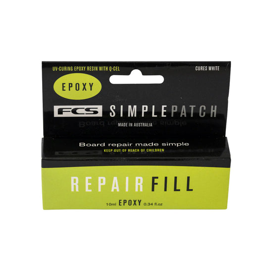 A 10ml box of FCS Surfboard Repair Epoxy for board repairs, in black and green packaging with product details and usage instructions.