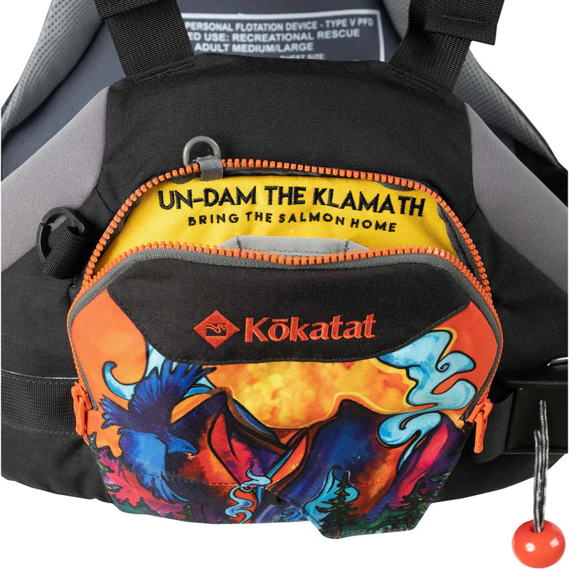 Close-up of a colorful Kokatat HustleR Whitewater Rescue PFD with a message advocating for the removal of dams on the Klamath River to aid salmon migration.