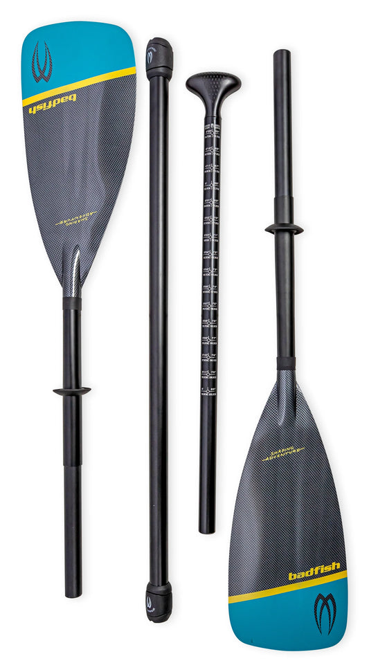 Four pieces of the Badfish Hybrid SUP / Kayak Paddle in blue and yellow with black shafts are displayed, showing paddle blades, handle, and measurement markings on one shaft section.