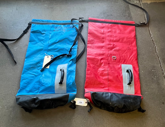 Rental Fleet with Two Used Jacks Plastic Outfitter Drybag 70L next to each other.