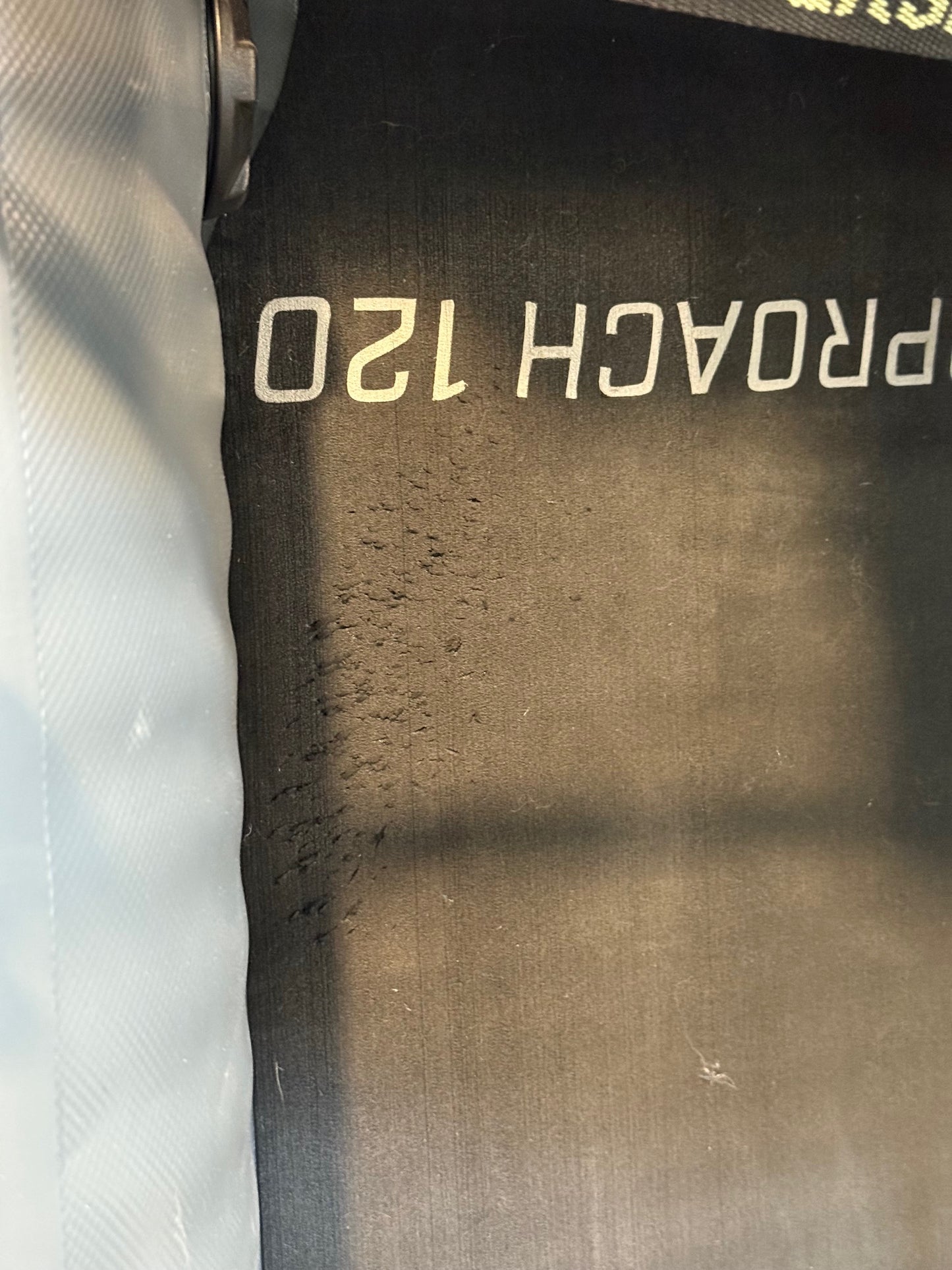 Close-up of a treadmill belt labeled "PROACH 120" with visible wear, reminiscent of the durability seen on an NRS Approach Fishing Raft - Floor Model after many outdoor adventures.