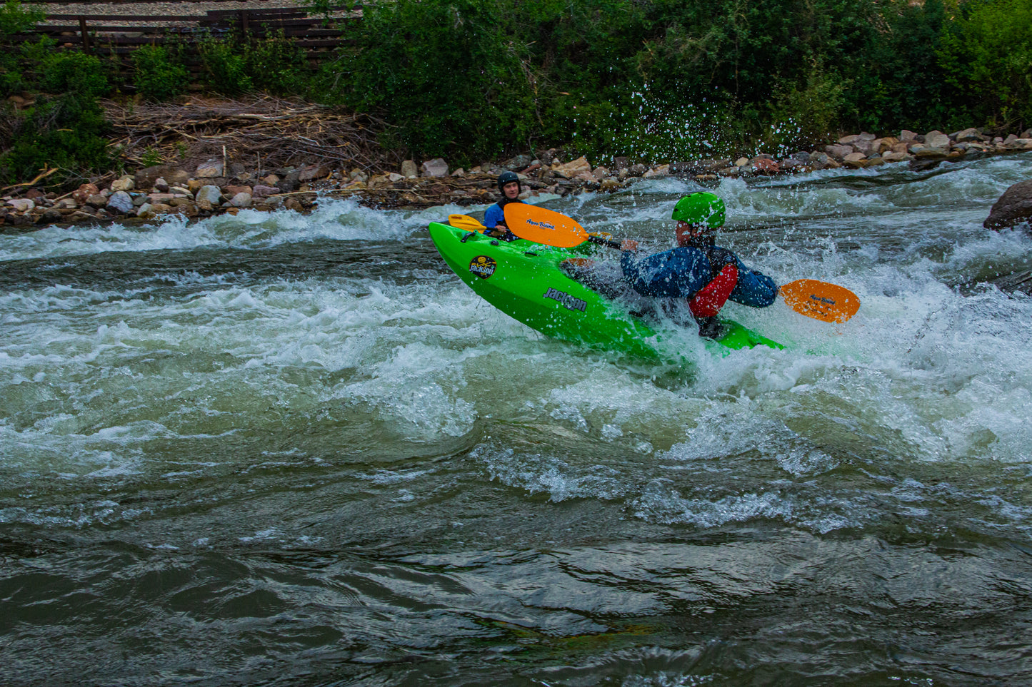 A man with youth level 2 skills river running in a 4CRS Paddle School Young Adult Level 2 Kayak Class.