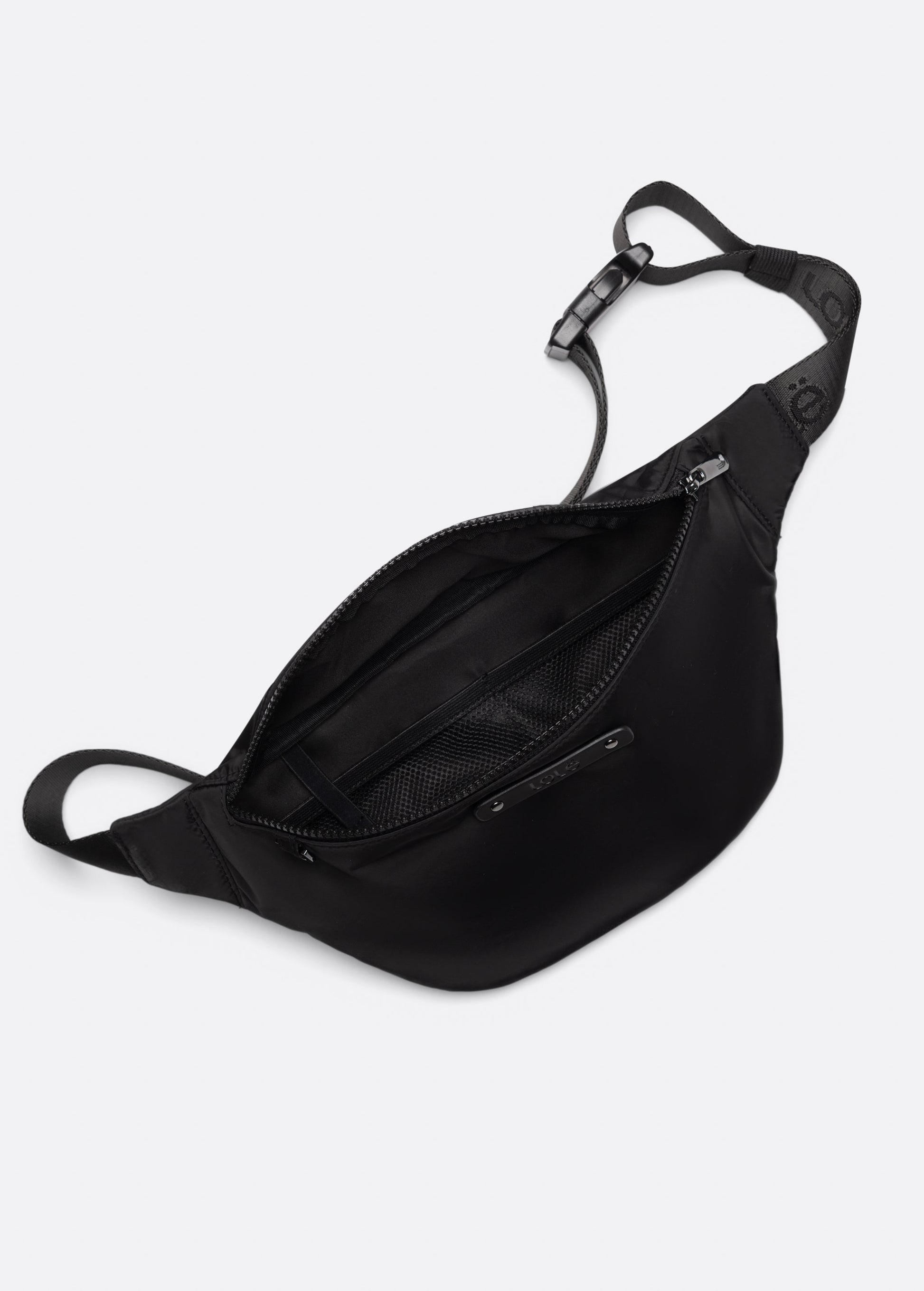 The Lole Taylor Belt Bag features an adjustable strap and zippered closure, shown open to display its inner mesh pocket and roomy main compartment with a secure zip pocket, all set against a white background.