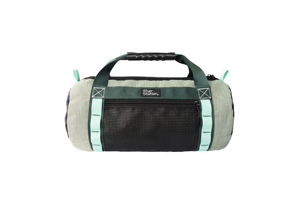 The River Station Gear Small Mesh Duffel is a cylindrical whitewater bag with a black UV-protective mesh front pocket, green handles, and light blue accents, shown on a white background.
