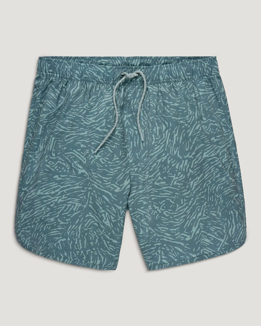 The Free Fly Youth Reverb Short features a teal color with a light blue abstract wavy pattern, an elastic waistband with drawstring, and is crafted from quick-dry fabric. Displayed on a plain background.