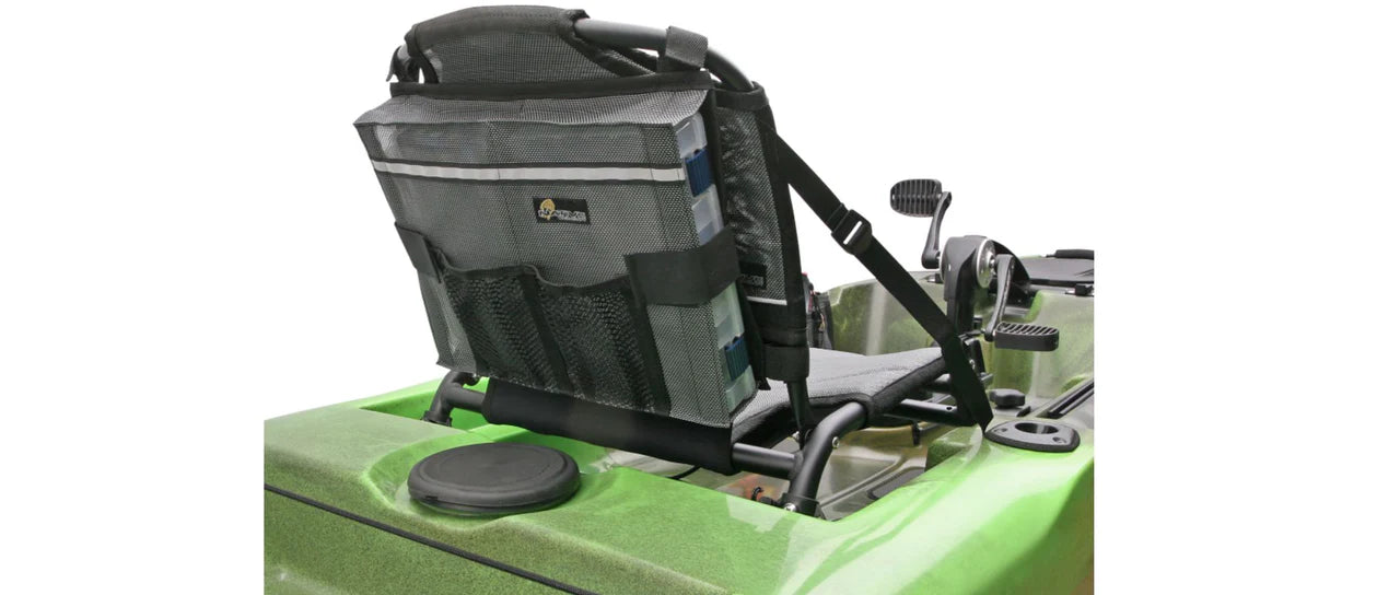 Rear view of a Native Watercraft Seat Back Tackle Box Storage attached to a green kayak, featuring padded gray seat, mesh pockets for tackle storage, visible seat straps, pedals, and circular hatch.