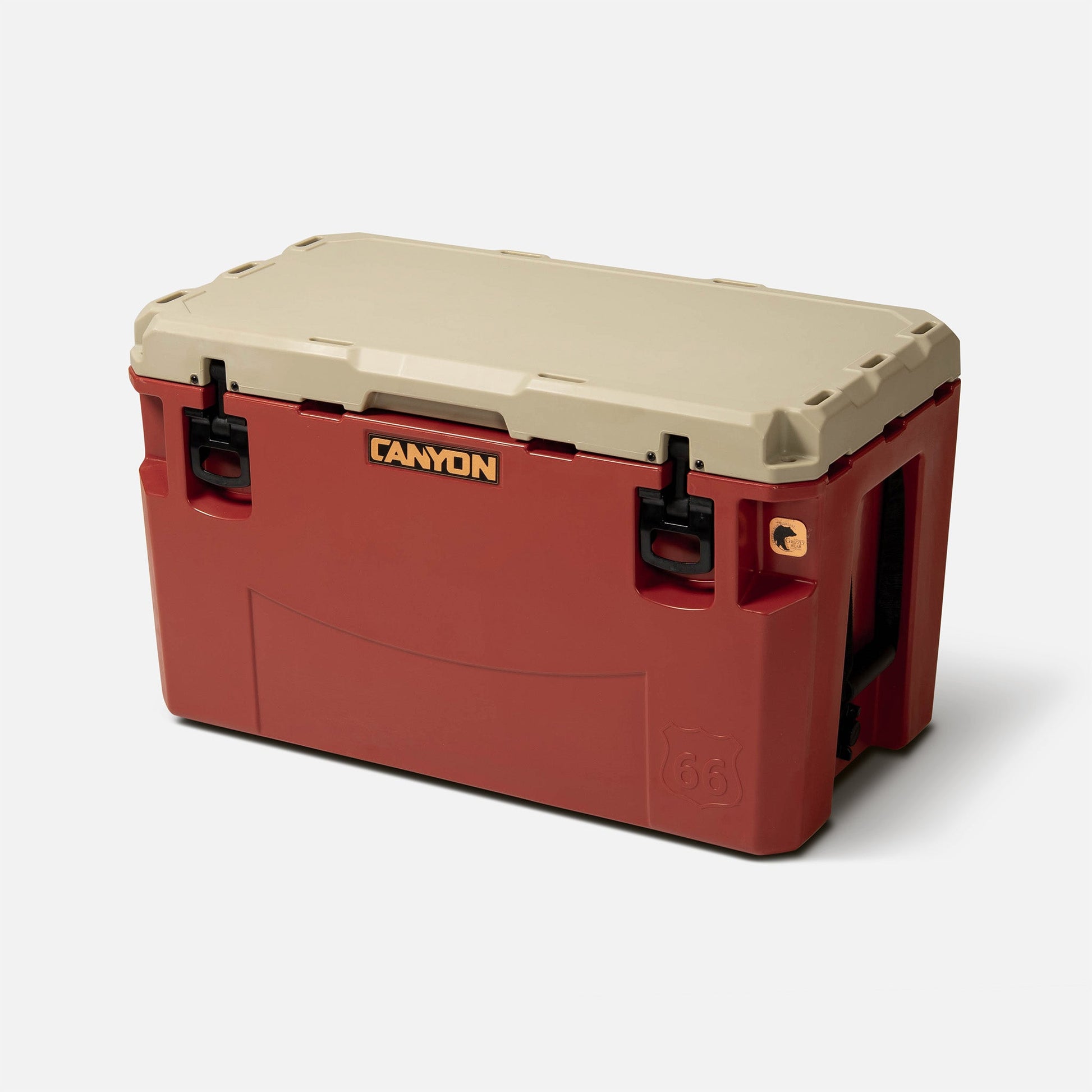 A spacious red roto-molded PRO Series Cooler by Canyon Coolers, with a beige lid, black latches and handles, and the Canyon logo on front—engineered for maximum ice retention.