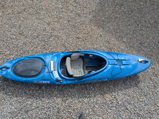 A pre-owned Consignment LiquidLogic XP9 kayak in blue by LiquidLogic sits on small pebbles, seen from above.