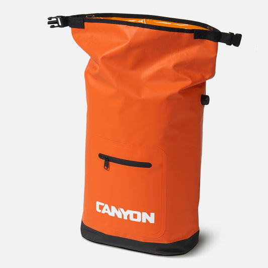 The orange waterproof Coulee Backpack Cooler by Canyon Coolers boasts a roll-top opening, front zippered pocket, black accents, and "CANYON" in white on the front. It features cushioned straps for extra comfort during adventures.
