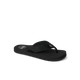 The REEF Smoothy Flip is a black flip-flop sandal with a textured strap and flat sole, offering cushy footbed comfort. Displayed on a plain white background.