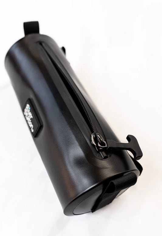 The Drylap - Kayak Dry Bag by River Station Gear is a black cylindrical waterproof bag with zippered closure and hook attachment, ideal for kayaking, shown resting on a white surface.
