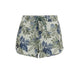 Front view of the FlyLow Marion Short W's by Flylow, showcasing a blue and green floral pattern, drawstring waist, and a small round patch on the left hem.