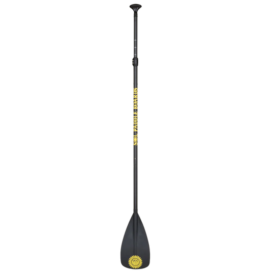 The Carbon Blaster 3-Piece Travel SUP Paddle by SOL Paddle Boards is black with a yellow sun logo and "GLOBAL BREAKERS" on the carbon shaft, featuring an ergonomic handle, wide flat blade, and adjustable length for convenience.