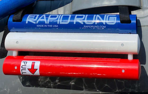 The Raft Ladder by Rapid Rung has three connected cylindrical holders: blue labeled "RAPID RUNG," white middle, and red bottom marked "PULL" with an arrow. It's ideal for versatile use, inspired by the design efficiency of a self-retracting swim ladder.
