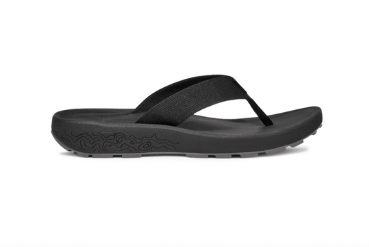 The DECKERS Hydratrek Flip-Flops - Men's, featuring a black design with textured soles and fabric straps, are ideal for water adventures and are displayed in side profile on a white background.