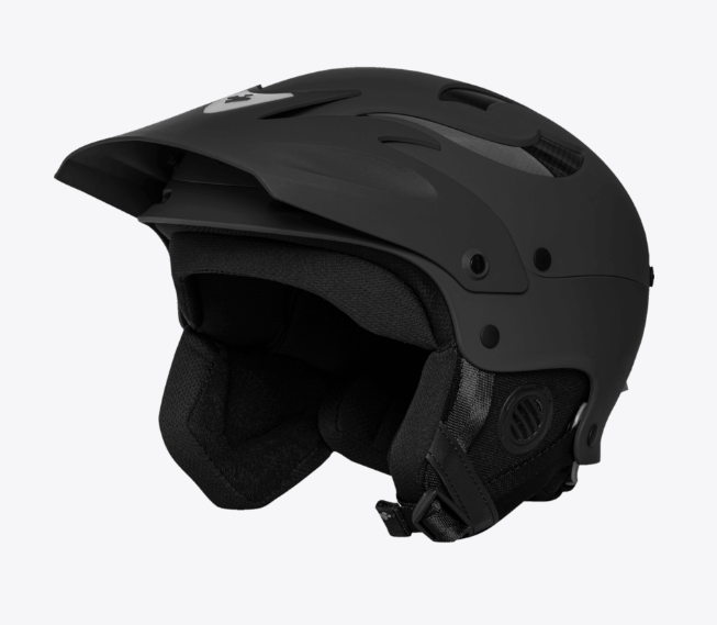 The Sweet Protection Rocker Helmet is a matte black ski or snowboarding helmet with TLC Shell Technology, ear protection, air vents, and an adjustable chin strap, displayed against a plain background.