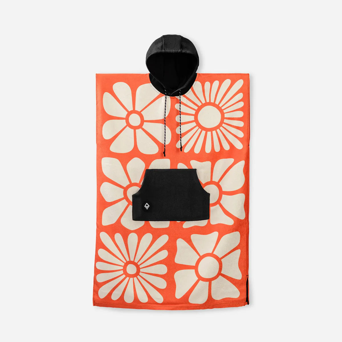 The Nomadix Changing Poncho features large white floral patterns on an orange background, plus a black hood and front pocket.