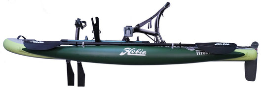 Side view of a green Hobie Mirage iTrek Angler 10 inflatable fishing kayak, featuring an attached seat, MirageDrive 180 pedal system, oars, and rudder.
