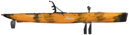 A yellow and black pedal drive kayak, the Hobie Mirage Outback 12'9, with a paddle attached for hands-free maneuverability.