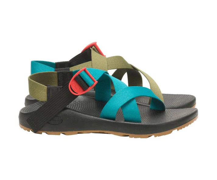 The Chaco Z1 Classic - Men's features black soles, olive green and turquoise earth-toned straps, red buckle accents, and a podiatrist-approved footbed—perfect for outdoor enthusiasts who value both style and comfort.