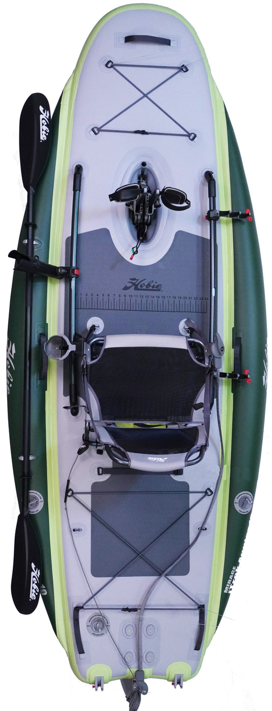Top-down view of the Hobie Mirage iTrek Angler 10, a green, white, and grey inflatable fishing kayak with the MirageDrive 180 pedal system, central seat, steering handles, rod holders, paddle holders, and premium branding.
