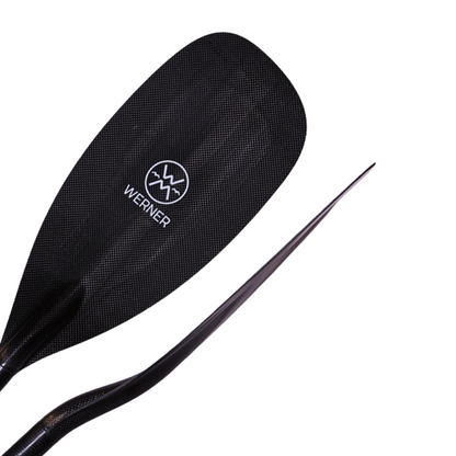 The Covert kayak paddle by Werner Paddles features a stealth blade design, perfect for racing, with a curved carbon fiber blade ensuring optimal performance and efficiency on the water.