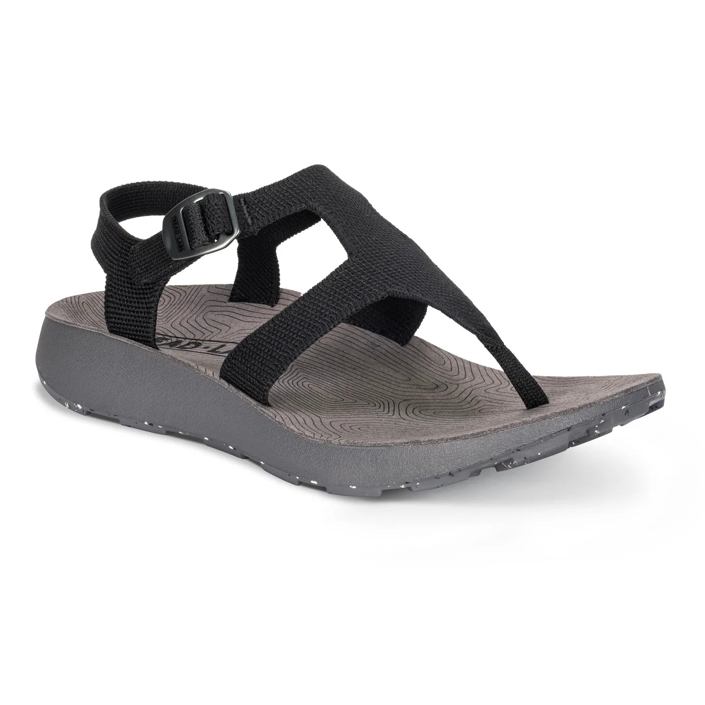 The Women's Albion Sandal by Tread Labs features a black strappy design with a durable rubber outsole, adjustable buckle, textured gray footbed, and speckled gray sole.