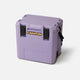 A lavender Canyon Coolers Outfitter 22 V2 Cooler with a handle, black latches, and "22" embossed on the bottom right—this compact day cooler is built for durability.