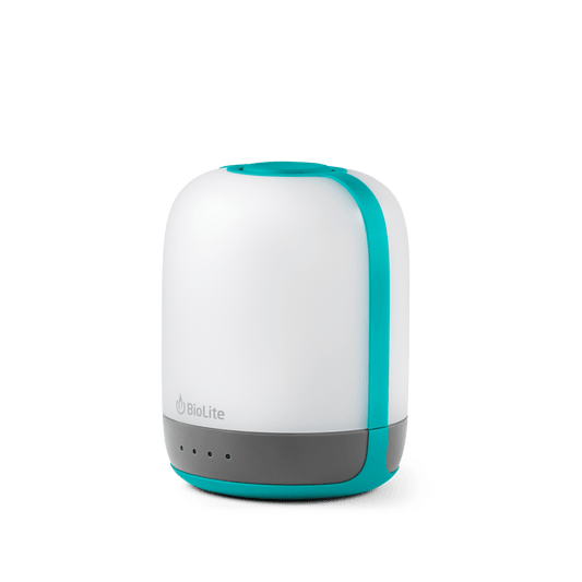 The BioLite AlpenGlow 250 is a white and teal rechargeable lantern with a gray base, ChromaReal LED tech, a power button, and four indicator lights for vibrant ambient lighting.