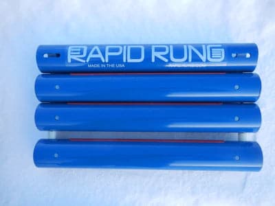 A set of blue Rapid Rung rollers with the word Raft Ladder on them.