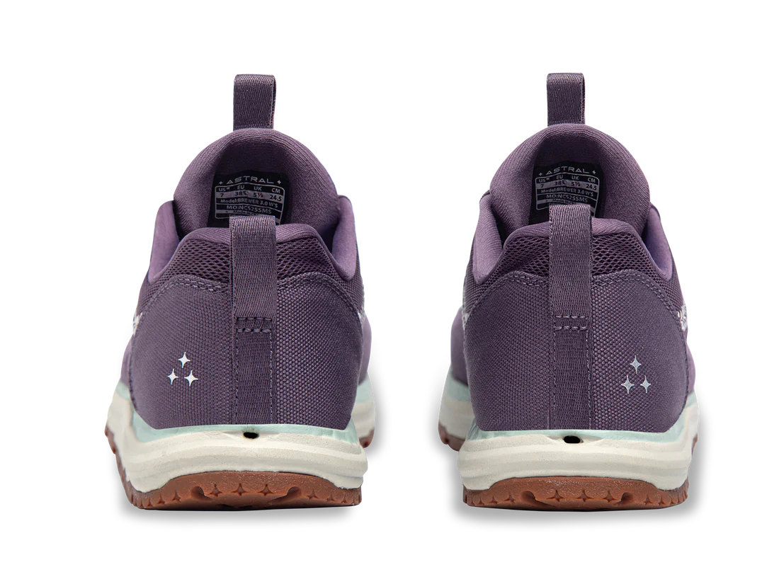 Rear view of Astral's Brewer 3.0 sneakers in purple with white midsoles, brown outsoles, and hydrophobic canvas features three white stars on each heel.