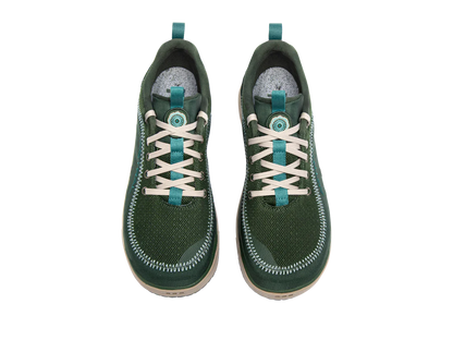 The Astral Brewer 3.0, green sneakers with beige laces, are made from hydrophobic canvas with a textured surface and white stitching. Ideal for kayakers seeking stylish yet practical footwear for water adventures.