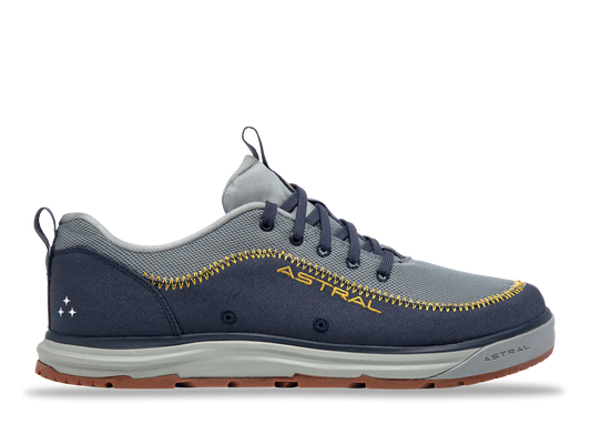 The Brewer 3.0 by Astral in gray and navy, ideal for kayakers, boasts a hydrophobic canvas with yellow stitching and a grippy sole for water activities, finished with a lace-up closure.