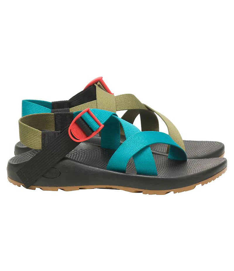 The Chaco Z1 Classic - Women's sandal features black soles, brown outsoles, teal and olive green straps, and red buckle accents—ideal for hiking and outdoor adventures.
