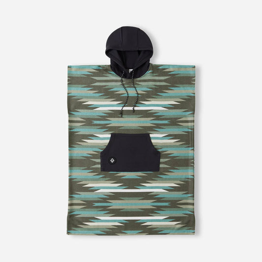 The Nomadix Changing Poncho features a geometric green and blue design, black hood with drawstrings, and a spacious front pocket, shown against a plain background.