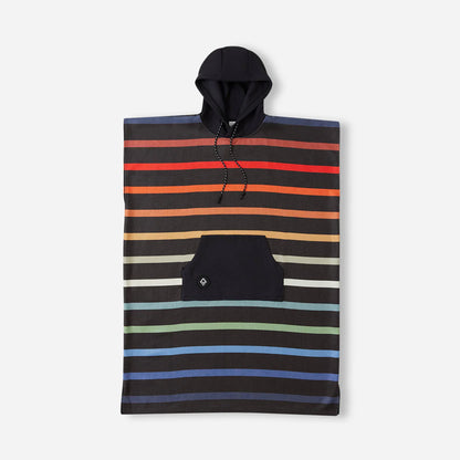 The Nomadix Changing Poncho features horizontal stripes in various colors on a black background and includes a front kangaroo pocket.