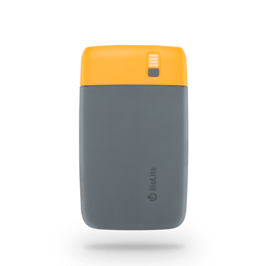 The BioLite Charge 20 PD Power Bank is a compact portable charger with a gray body, yellow top, LED indicator, and USB-C Power Delivery for fast charging while traveling.