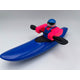 The Foamie Creeker by Foamie Friends features a figure kayaking in a vivid blue kayak with pink arms. Equipped with a stylish blue helmet and sunglasses, it's all set to tackle any waterway while gripping durable black paddles.