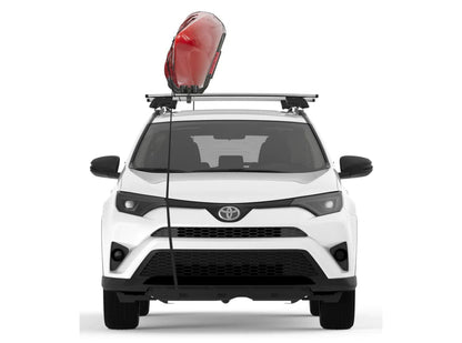 a white Toyota RAV4 with a Yakima JayHook kayak rack on top.