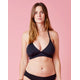 A woman in a Carve Dahlia Top bikini posing for a picture.