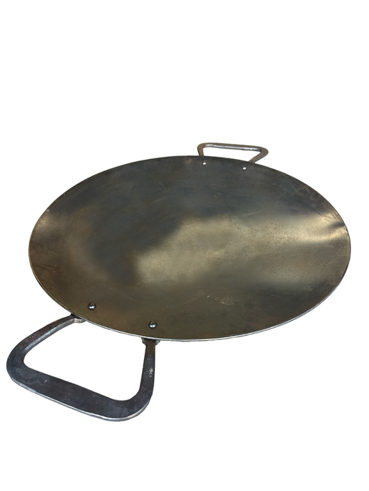 The LavaBox SWOK Discada Combo is a round, flat metal griddle with two side handles, ideal for versatile outdoor cooking or roasting.